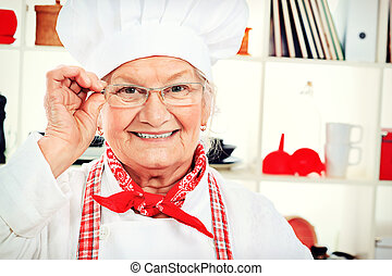 home cooking - Portrait of a senior woman chef cook in the... ... - canstock13284067