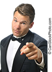 <b>Tux man</b> points finger - Handsome Caucasian man in black. - canstock14050386