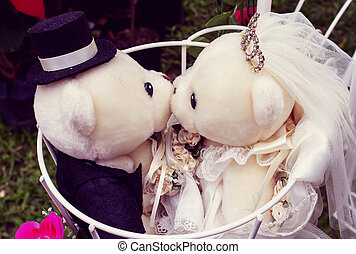 two teddy bears kissing