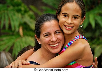 hispanic mother daughter hugging generations three canstockphoto