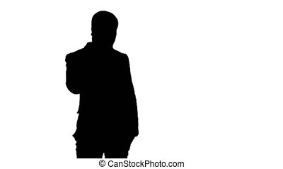 Silhouette arab business man talking on the mobile phone. professional shot  in 4k resolution. 065s. you can use it . in | CanStock