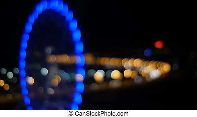 Ferris wheel . view from the hotel window at night. night city. bokeh. |  CanStock