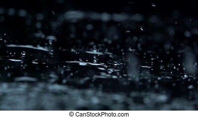 Water rain drops on black background. slow motion. macro. Water rain drops  on black background. slow motion. macro. | CanStock