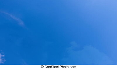 Beautiful time-lapse clouds on a background of blue sky video loop.  Beautiful time-lapse clouds on a background of blue sky. | CanStock