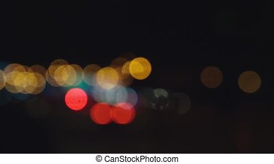 Driving at night. view the windshield and blurred cars in the city. window  of the front car with a blurred city traffic on | CanStock